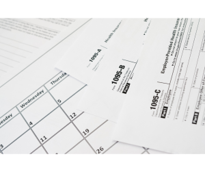 Image of multiple 1095 tax forms, A, B, and C